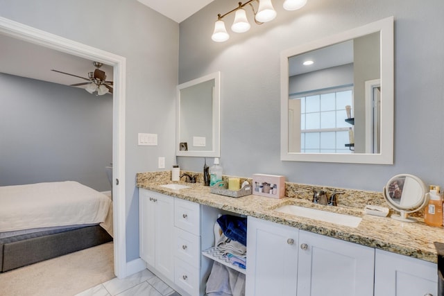 bathroom with ceiling fan and vanity