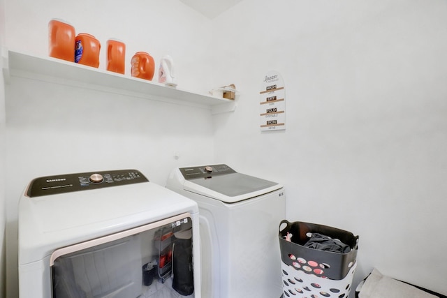 laundry area with washing machine and clothes dryer