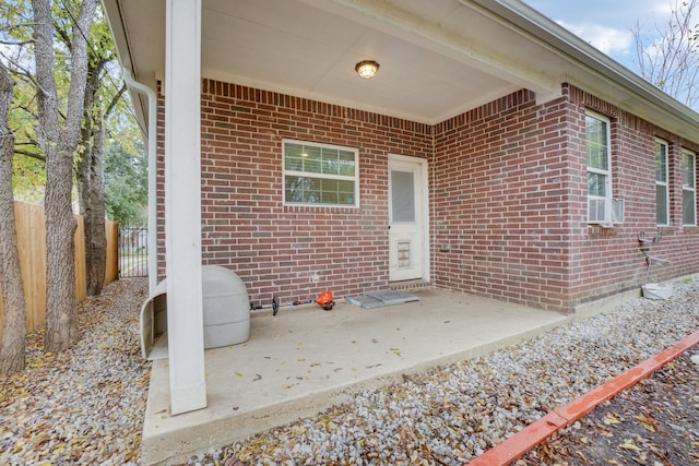 entrance to property featuring a patio