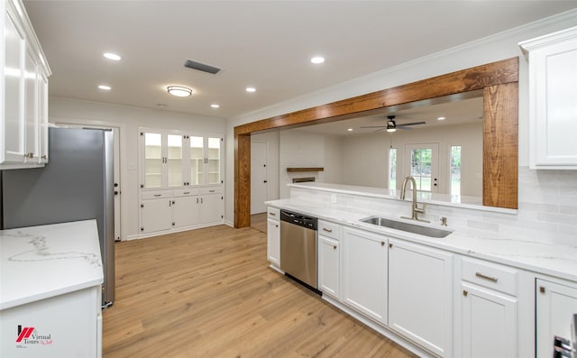 kitchen featuring stainless steel appliances, ceiling fan, sink, light hardwood / wood-style flooring, and white cabinetry