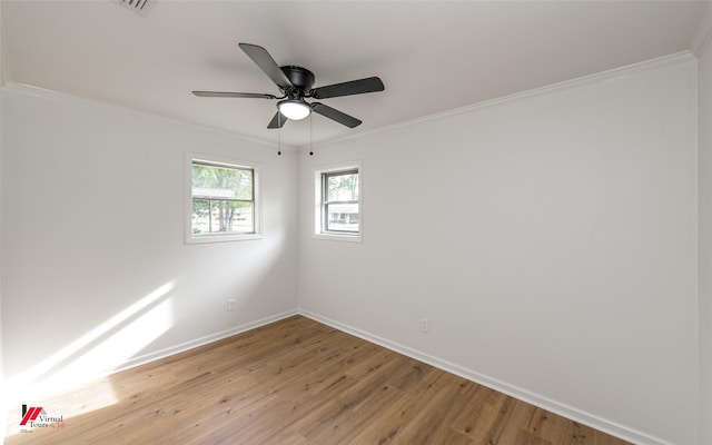 unfurnished room featuring hardwood / wood-style flooring, ceiling fan, and ornamental molding