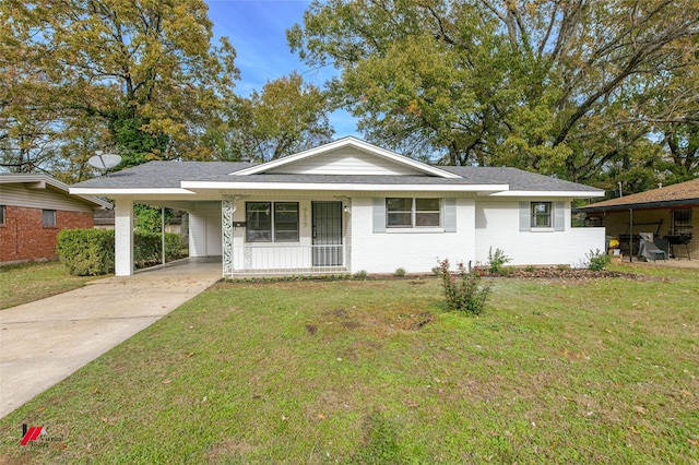 ranch-style home with a front lawn and a carport