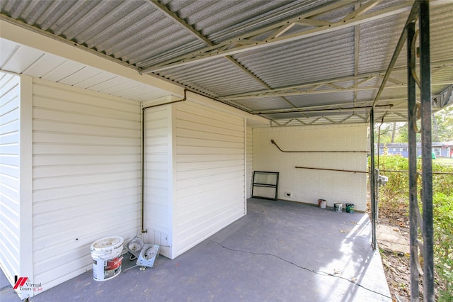 exterior space with a carport