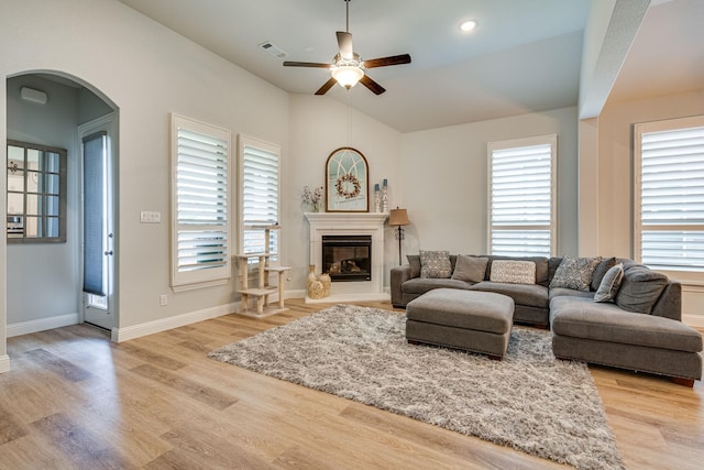 living room with a wealth of natural light and light wood-type flooring