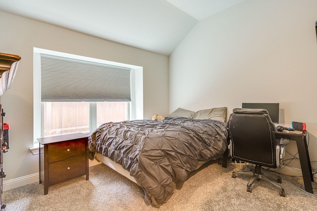 carpeted bedroom featuring vaulted ceiling