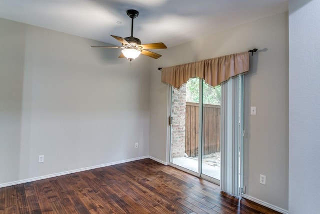 empty room featuring dark hardwood / wood-style flooring and ceiling fan