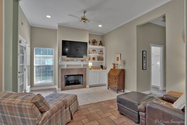 9622 Norris Ferry Rd, Shreveport, LA 71106 - living room with a ceiling fan, a tile fireplace, crown molding, recessed lighting, and built in features