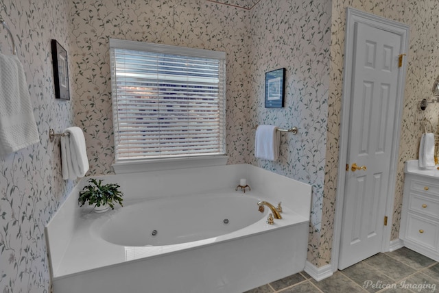 bathroom featuring tile patterned flooring and a tub