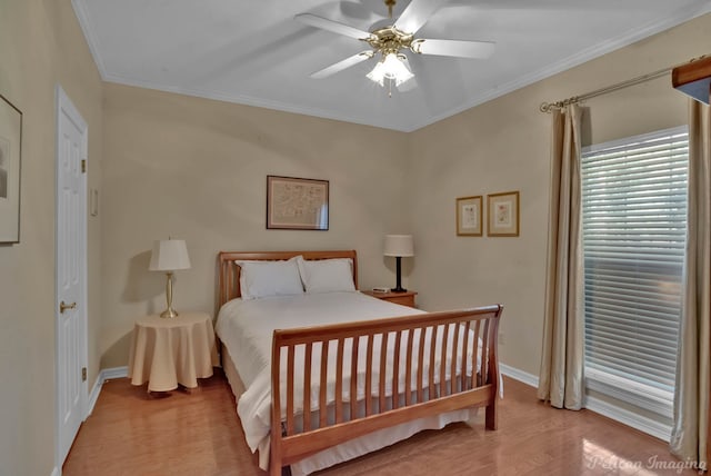 bedroom with crown molding, ceiling fan, and light wood-type flooring