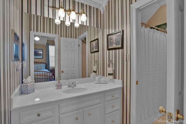 bathroom with a shower with curtain, vanity, and ornamental molding