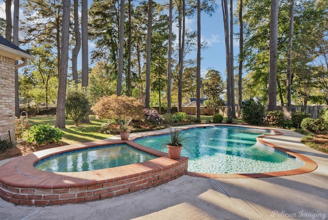 view of pool featuring an in ground hot tub and a patio area