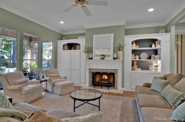 9622 Norris Ferry Rd, Shreveport, LA 71106 - living area with ceiling fan, a lit fireplace, ornamental molding, and recessed lighting
