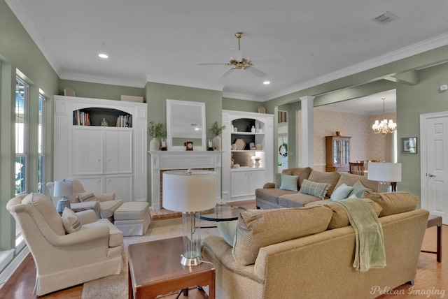 9622 Norris Ferry Rd, Shreveport, LA 71106 - living room with a chandelier, a ceiling fan, decorative columns, recessed lighting, and crown molding