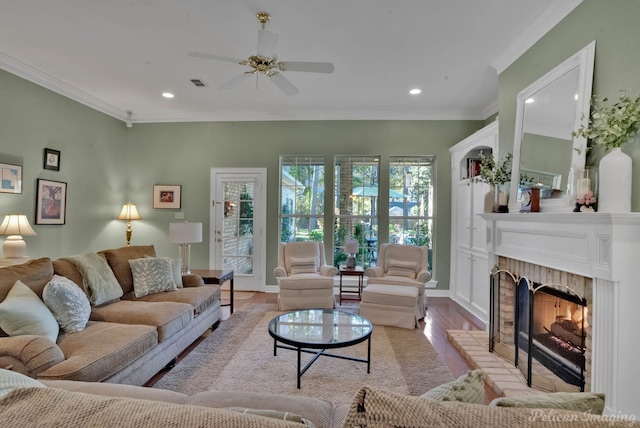 9622 Norris Ferry Rd, Shreveport, LA 71106 - living area with light wood-style flooring, a fireplace, recessed lighting, ceiling fan, and crown molding