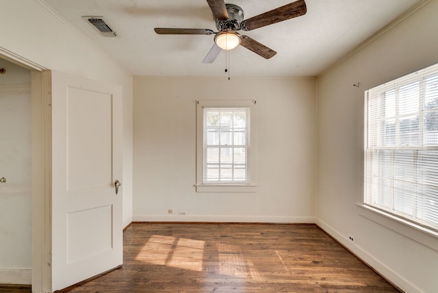 interior space with ceiling fan, wood-type flooring, and ornamental molding