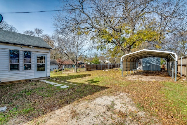 view of yard featuring a carport