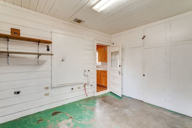 interior space featuring wood walls