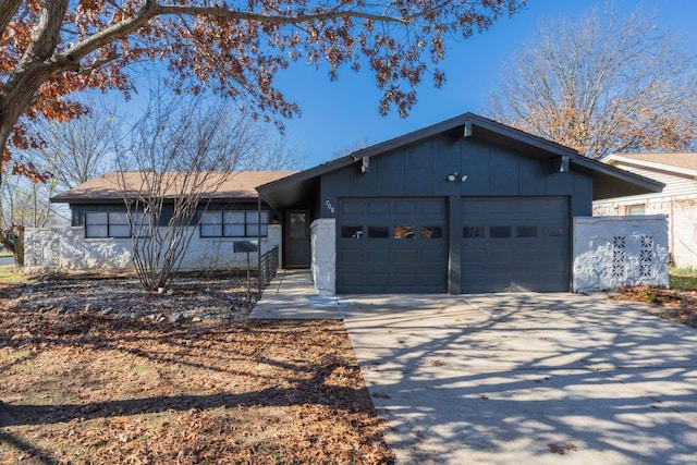 ranch-style home featuring a garage