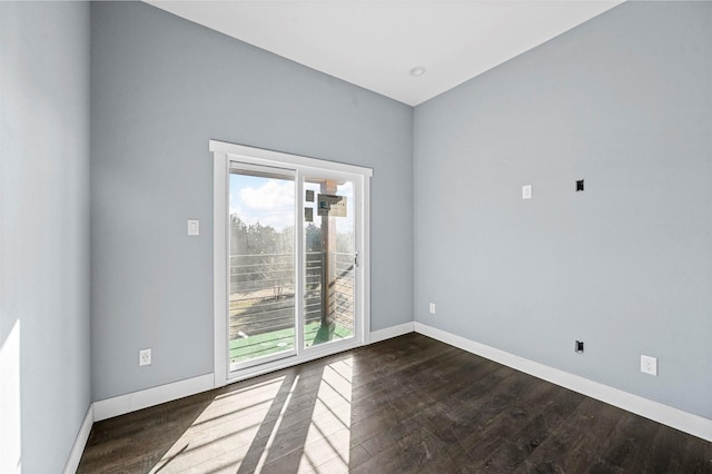 empty room with dark wood-type flooring