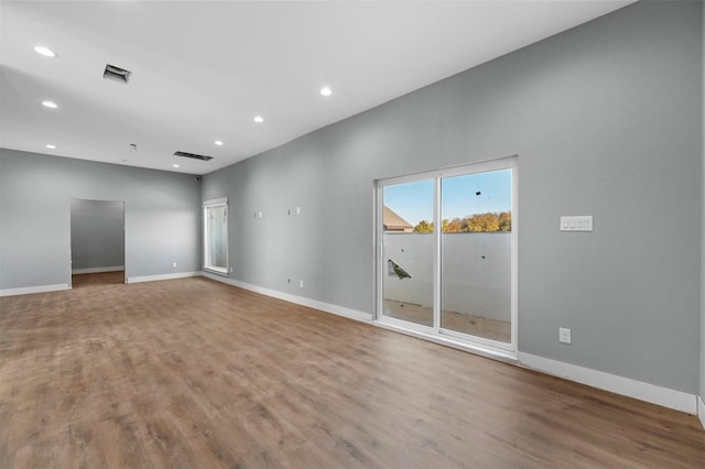 spare room with hardwood / wood-style flooring