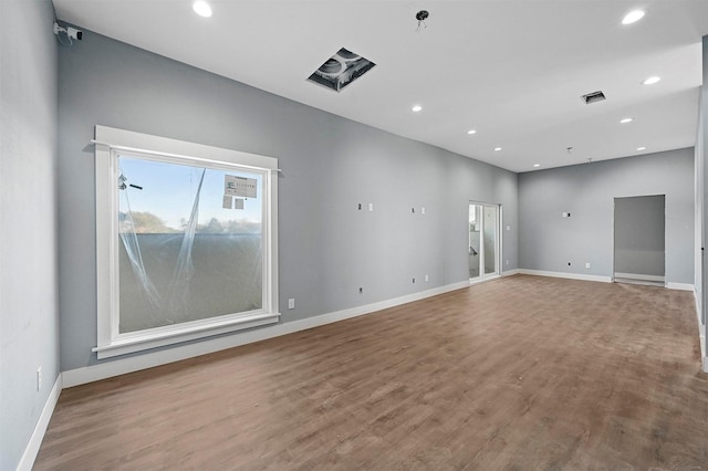 empty room with light hardwood / wood-style flooring