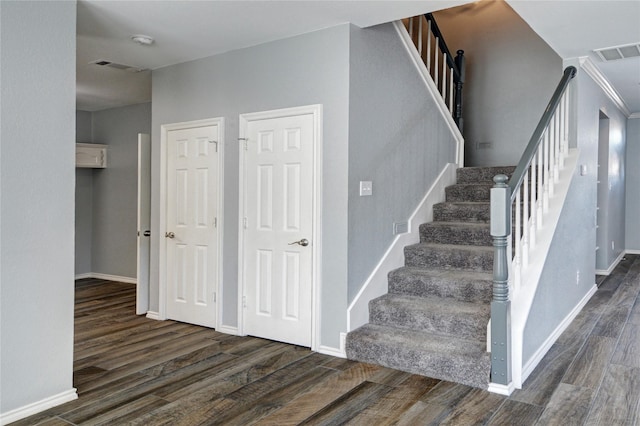 stairway featuring hardwood / wood-style flooring