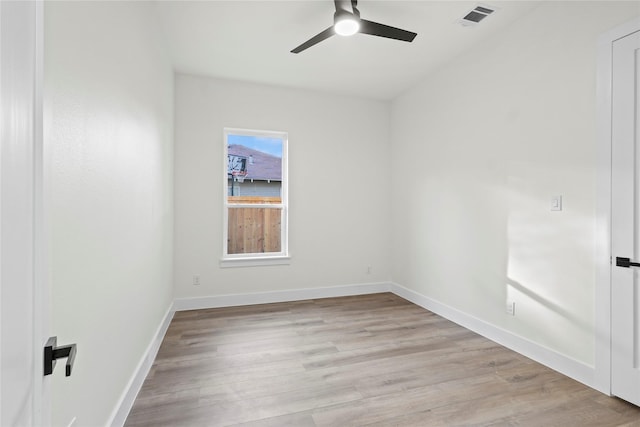 unfurnished room with ceiling fan and light wood-type flooring