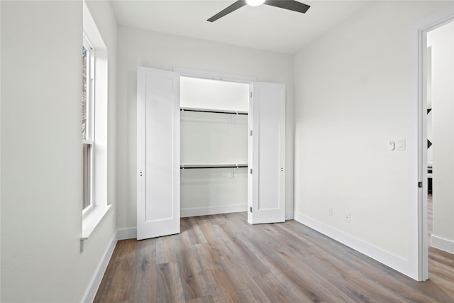 unfurnished bedroom with ceiling fan, a closet, and light hardwood / wood-style flooring