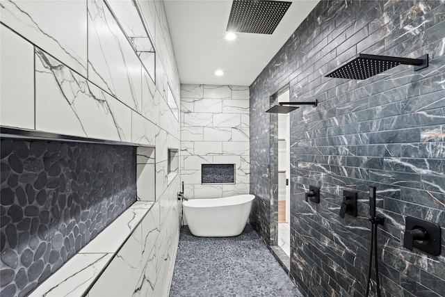 bathroom featuring independent shower and bath and tile walls