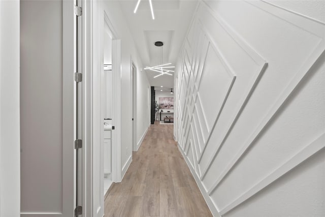 corridor featuring light hardwood / wood-style floors