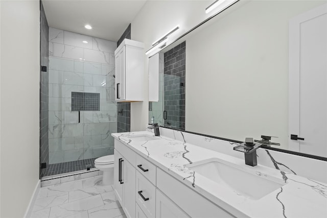 bathroom featuring vanity, toilet, and an enclosed shower