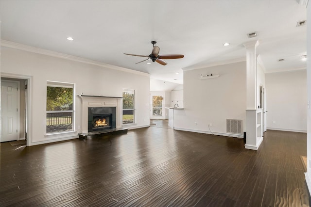 unfurnished living room with dark hardwood / wood-style flooring, a high end fireplace, ornamental molding, and ceiling fan