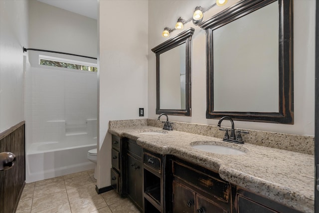 full bathroom with tile patterned flooring, vanity, shower / tub combination, and toilet