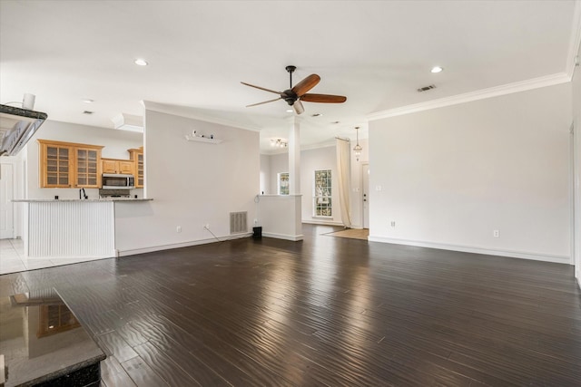 unfurnished living room with ornamental molding, dark hardwood / wood-style floors, and ceiling fan