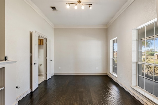 unfurnished room with dark hardwood / wood-style flooring, crown molding, and a healthy amount of sunlight