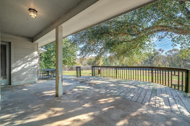 wooden deck with a lawn