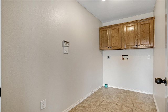 washroom with cabinets, electric dryer hookup, and washer hookup