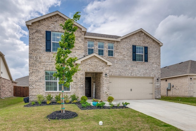 view of front of property with a front lawn and a garage