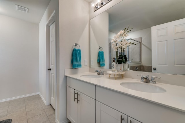 bathroom featuring tile patterned floors and vanity