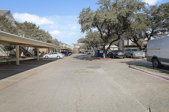 9601 Forest Ln Unit 412, Dallas, TX 75243 - view of asphalt road with a residential view