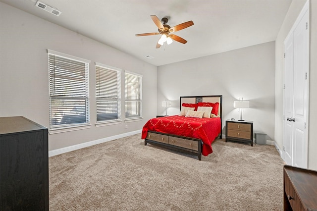 carpeted bedroom featuring ceiling fan