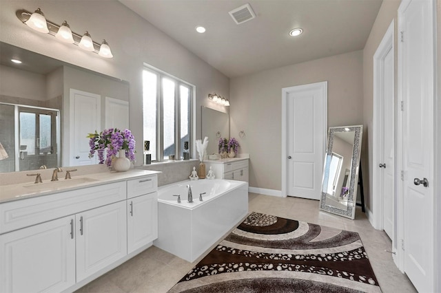 bathroom with plenty of natural light, shower with separate bathtub, and vanity