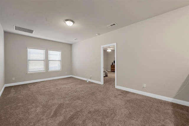 empty room featuring carpet and ceiling fan