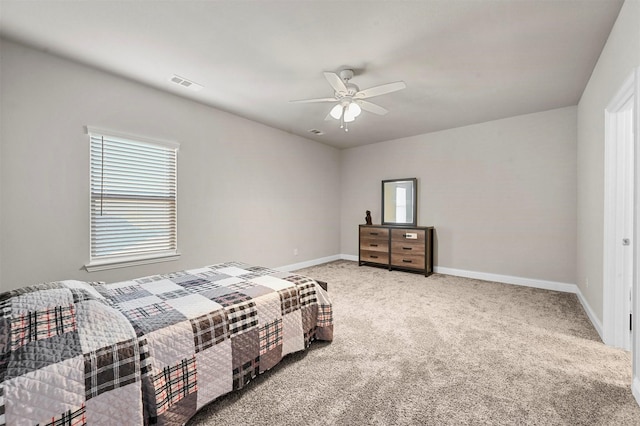 carpeted bedroom with ceiling fan