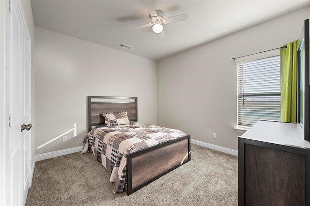 carpeted bedroom with ceiling fan