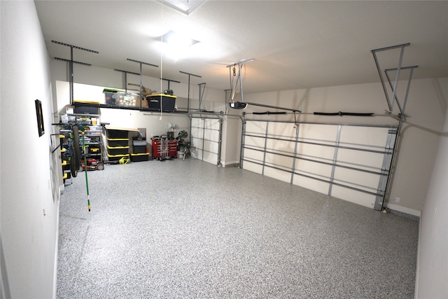 garage featuring a garage door opener