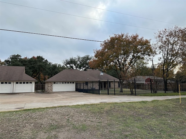 view of front of home with a front lawn and a garage