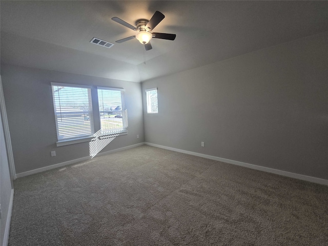 spare room featuring carpet and ceiling fan