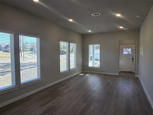 unfurnished room featuring dark hardwood / wood-style flooring