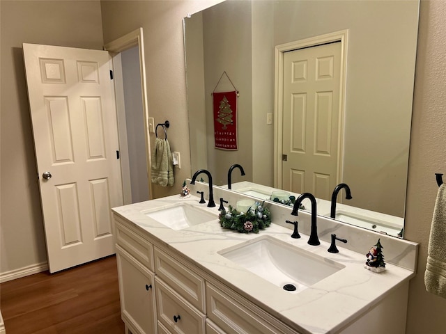 bathroom with wood-type flooring and vanity